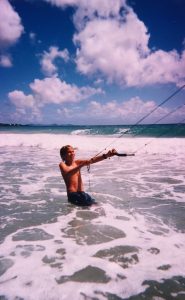 Jeremie learning to fly a kite as a kid