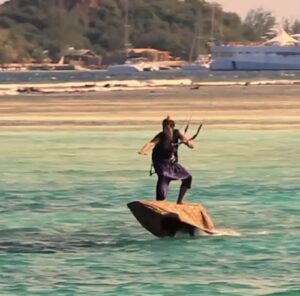 Jeremie kitesurfing in an Aladdin-style costume concept